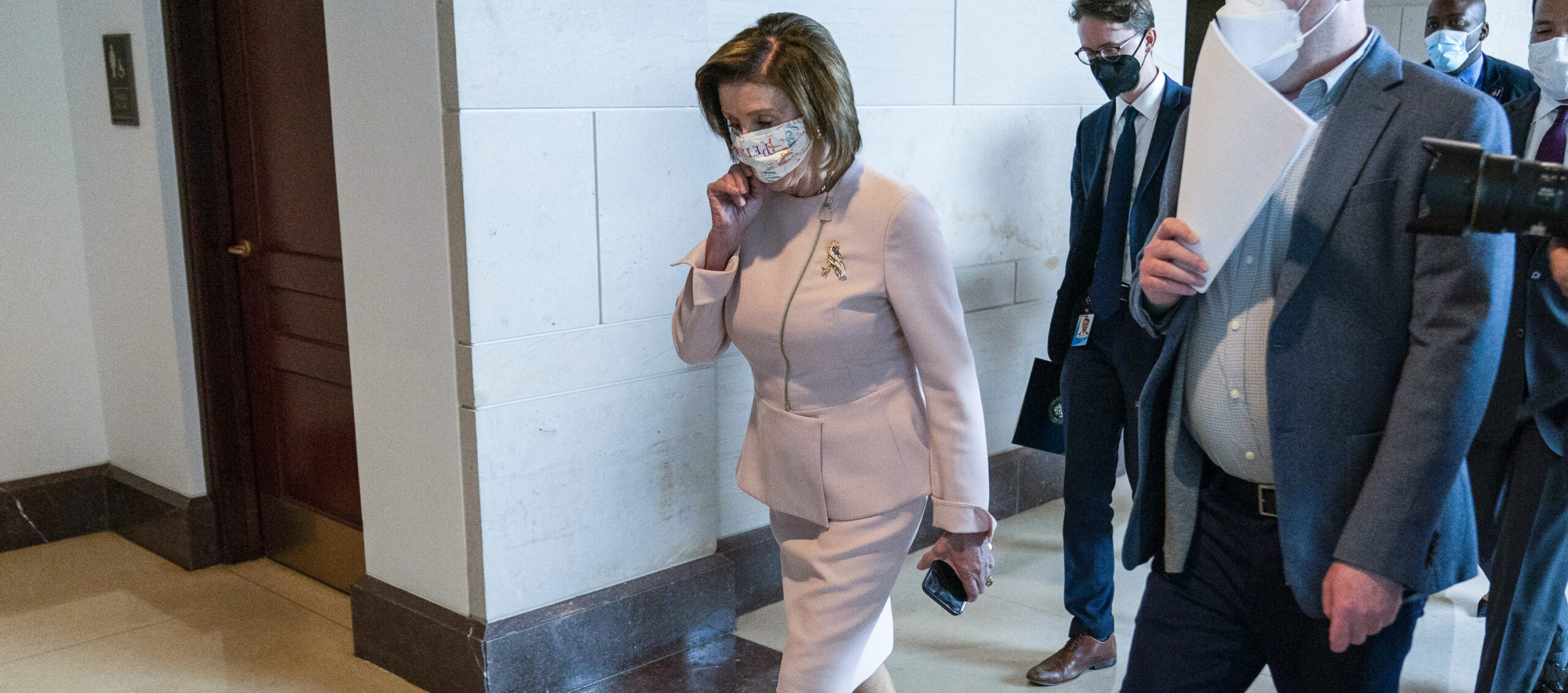 After Biden meeting, Pelosi calls spending bill deal within sight