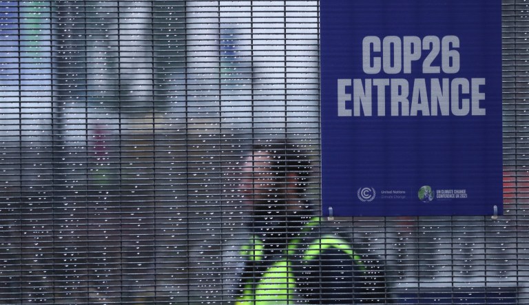 A fence is splattered with raindrops near the venue where the U.N. climate conference will be held in Glasgow, Scotland, Friday, Oct. 29, 2021. The U.N. climate conference COP26 starts Sunday in Glasgow.