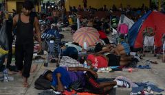 Migrant caravan delayed in Mexico by shooting and suspected Dengue fever outbreak