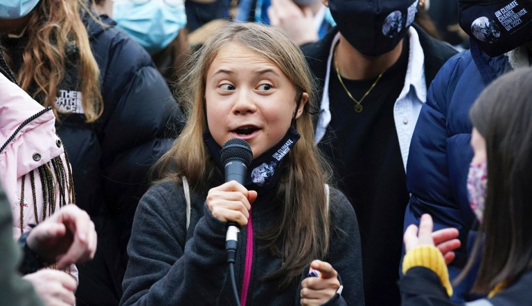 Swedish climate activist Greta Thunberg, centre, speaks alongside fellow climate activists during a demonstration at Festival Park, in Glasgow, on the first day of the COP26 summit, in Glasgow, Scotland, Monday, Nov. 1, 2021.