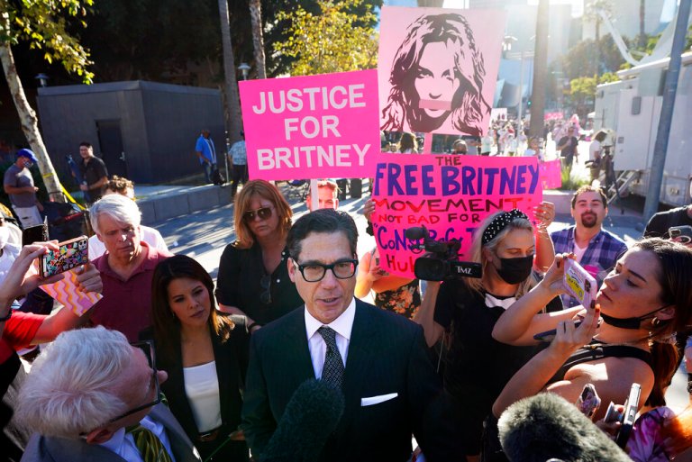 Matthew Rosengart, center, attorney for Britney Spears, leaves a hearing concerning the pop singer's conservatorship at the Stanley Mosk Courthouse, Friday, Nov. 12, 2021, in Los Angeles. A Los Angeles judge ended the conservatorship that has controlled Spears' life and money for nearly 14 years.