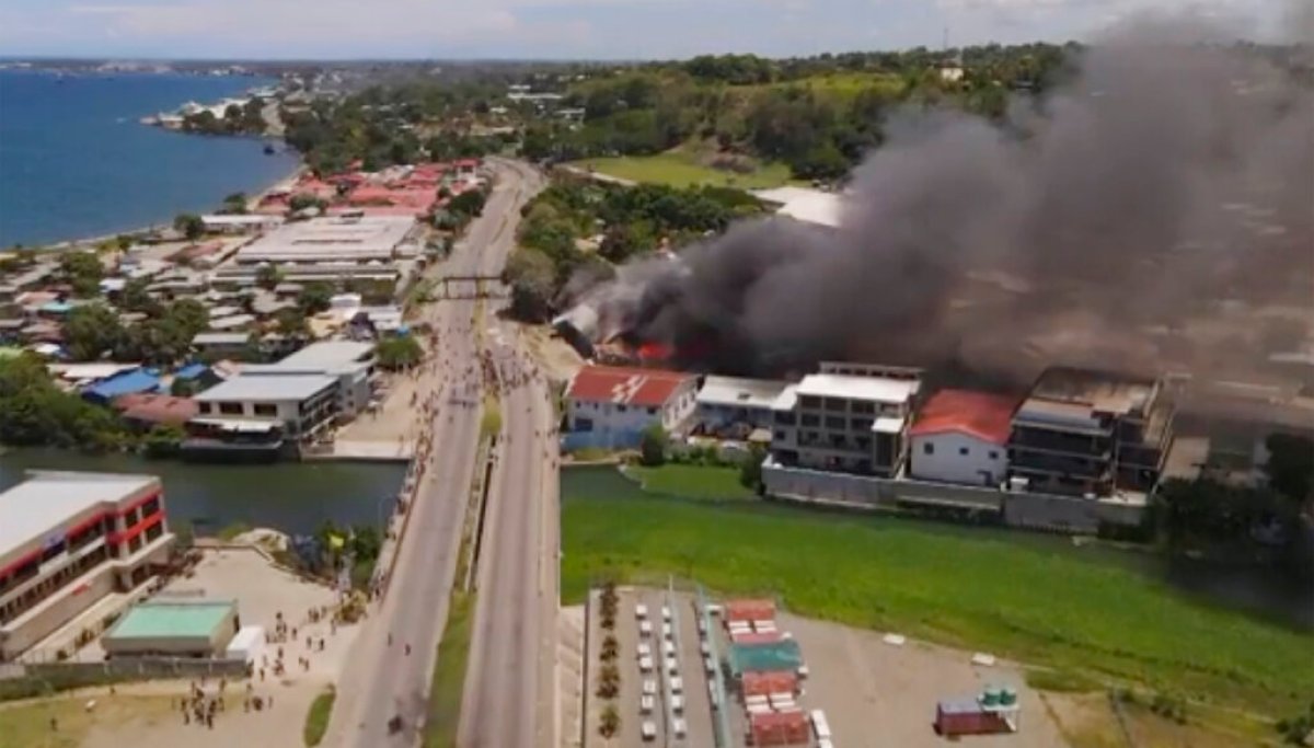 Australia sends forces to Solomon Islands where protesters set fire to Parliament and Chinatown