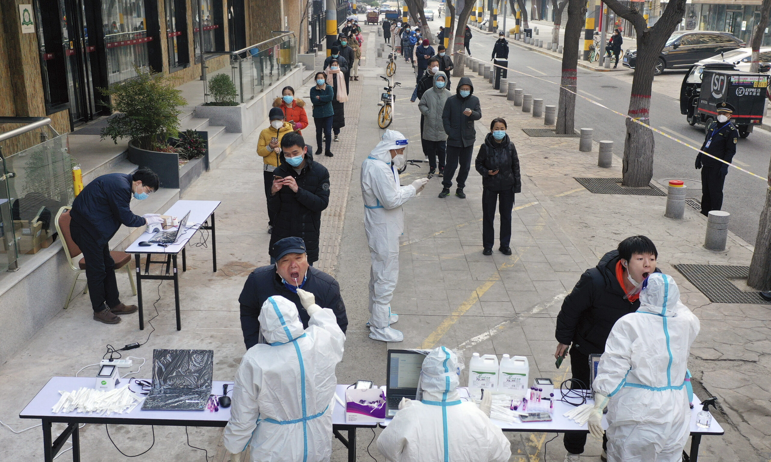 Chinese lab manager detained on suspicion of causing spread of COVID-19