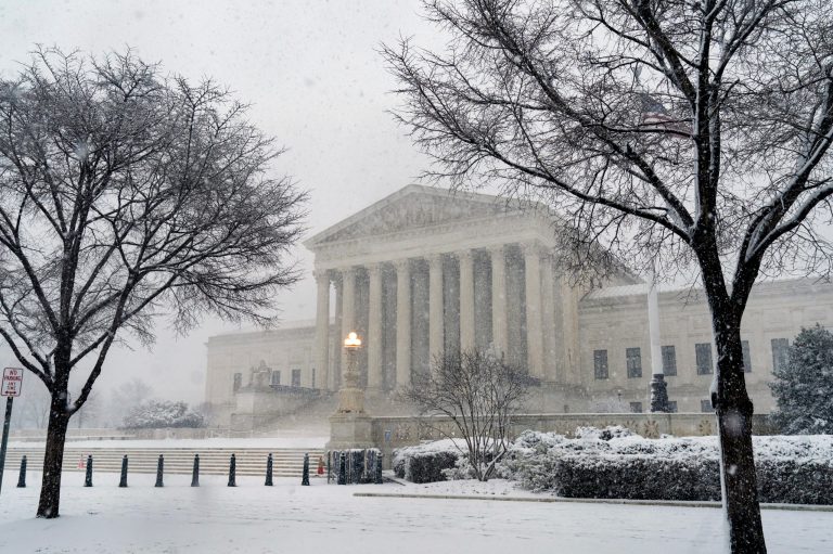 Supreme Court justices appear divided over vaccine requirements for big businesses