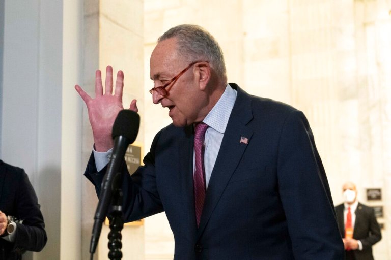 Senate Majority Leader Chuck Schumer, D-NY, speaks to the media after Senate Democrats met privately with President Joe Biden, Thursday, Jan. 13, 2022, on Capitol Hill in Washington.