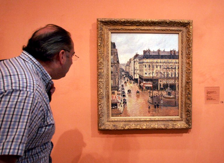 This May 12, 2005 file photo shows an unidentified visitor viewing the Impressionist painting called 