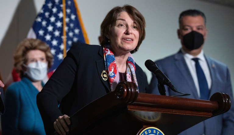 Sen. Amy Klobuchar, D-Minn., responds to questions from reporters alongside, from left, Sen. Debbie Stabenow, D-Mich., and Sen. Alex Padilla, D-Calif., during a press conference regarding the Democratic party's shift to focus on voting rights at the Capitol in Washington, Tuesday, Jan. 18, 2022.