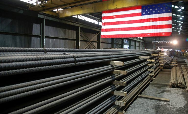 FILE - In this May 9, 2019, photo, steel rods produced at the Gerdau Ameristeel mill in St. Paul, Minn. await shipment. (AP Photo/Jim Mone, File)