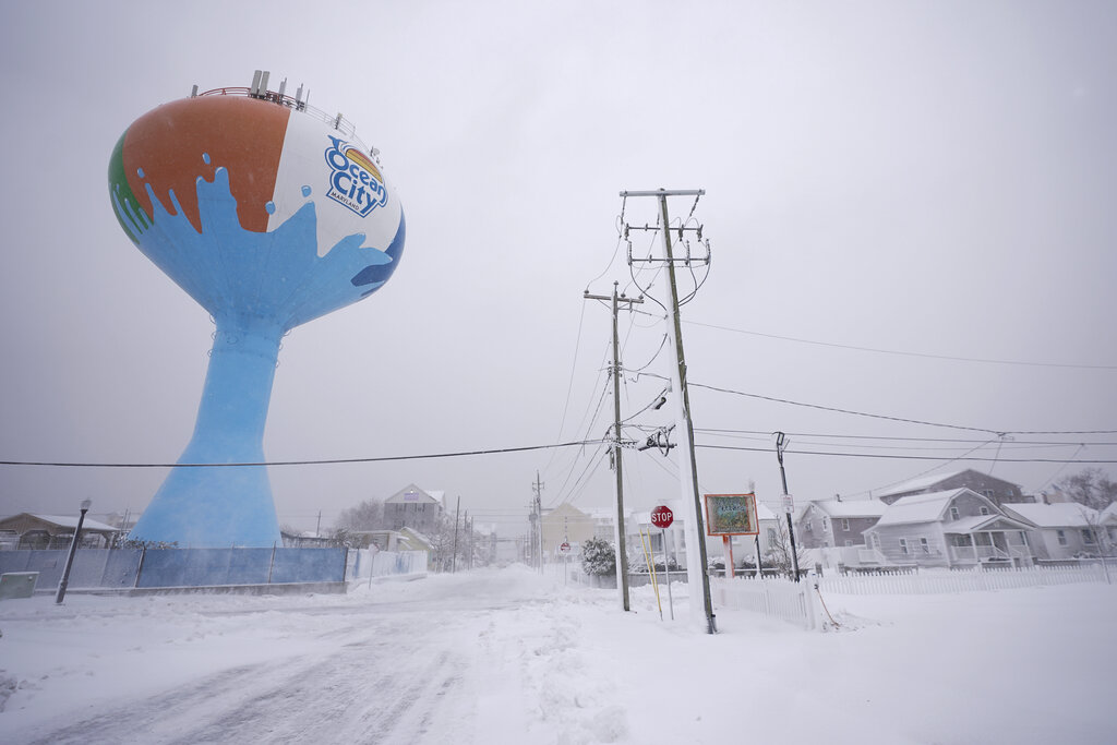 Snow covers roads and parking lots near the Ocean City, Maryland, water tower during a snowstorm Saturday.