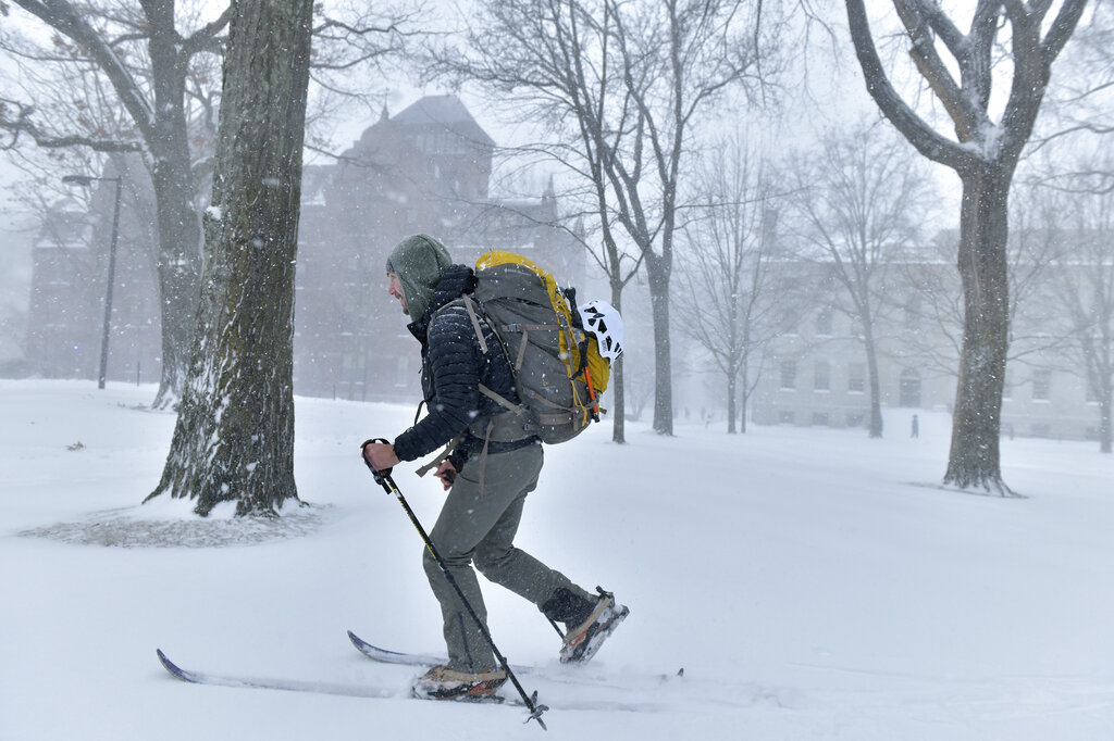 Harvard student Jack Lawlor skis through Harvard Yard on Saturday in Cambridge, Massachusetts.