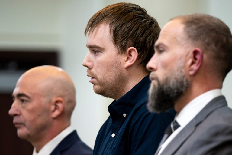 Travis Reinking, center, reacts as the verdict is read during day five of Reinking's murder trial at the Justice A.A. Birch Building in Nashville, Tennessee, Friday, Feb. 4, 2022. 