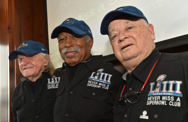 Members of the Never Miss a Super Bowl Club (from the left, Tom Henschel, Gregory Eaton, and Don Crisman) pose for a group photograph during a welcome luncheon in Atlanta on Feb. 1, 2019. The three men have attended every game since the first AFL-NFL World Championship held 55 years ago. They're meeting at the Super Bowl once again for this year's game, but future meetings are in question.