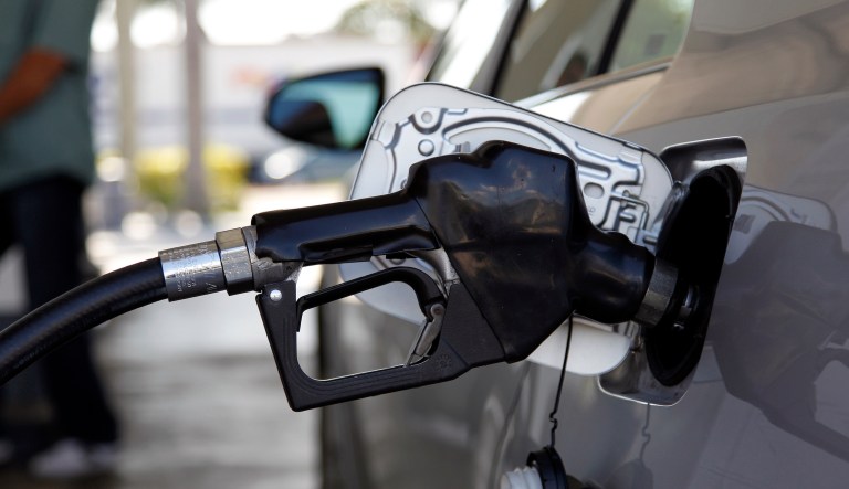 Fuel is pumped into a vehicle, Thursday, June 14, 2012, in Miami. Two Democratic senators are calling for suspending the federal gas tax for the remainder of 2022 to help consumers struggling with rising fuel prices (AP Photo/Lynne Sladky, File)