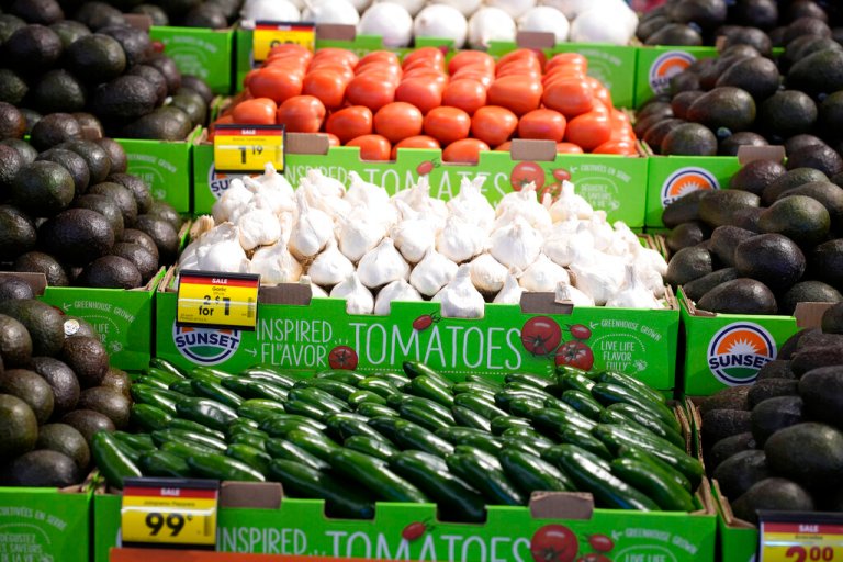 Jalapeno peppers, garlic and tomatoes are shown on display in the produce section of the Table Mesa King Soopers store during a media tour Tuesday, Feb. 8, 2022, in Boulder, Colo. 