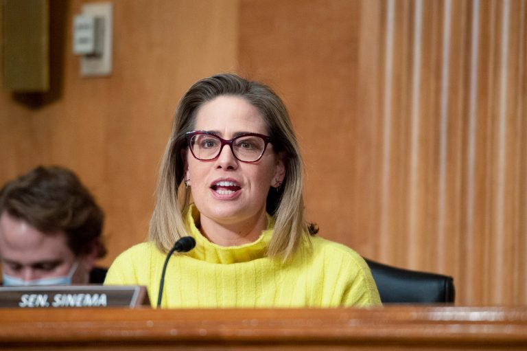 FILE - Sen. Krysten Sinema, D-Ariz., speaks during a Senate Homeland Security and Governmental Affairs Committee hearing on Feb. 1, 2022, in Washington. (Bonnie Cash/Bloomberg via AP, File)