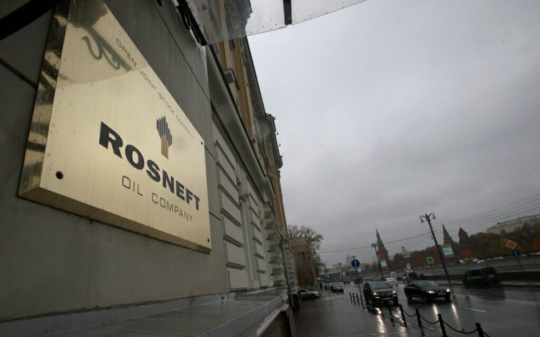 FILE - In this Oct. 18, 2012 file photo, a plaque of Rosneft is seen outside its headquarters in Moscow, Russia.