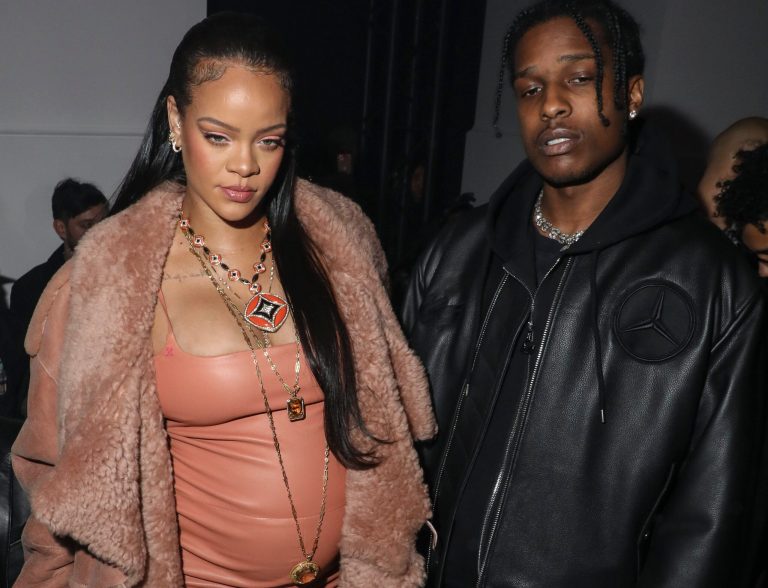 Rihanna (left) and ASAP Rocky arrive for the Off-White Ready To Wear Fall/Winter 2022-2023 fashion collection, unveiled during the Fashion Week in Paris on Feb. 28.