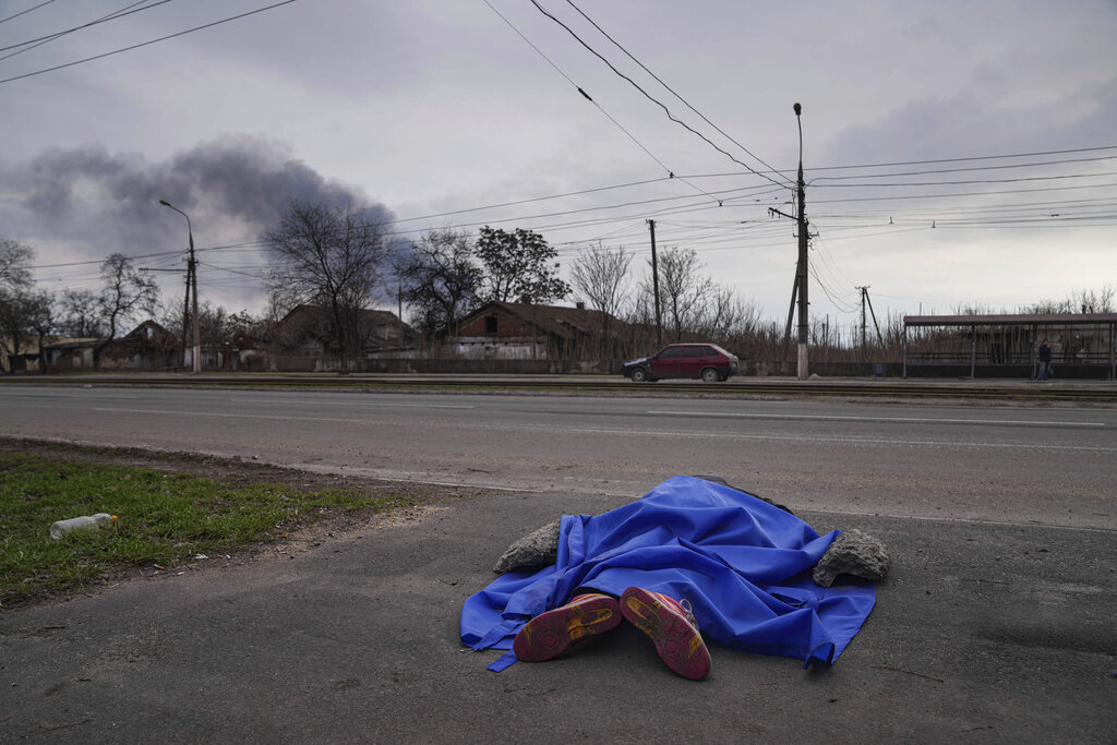 Mariupol officials open mass gravesite as death toll rises