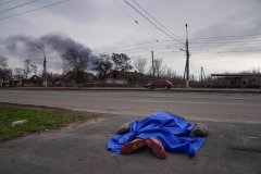 Mariupol officials open mass gravesite as death toll rises
