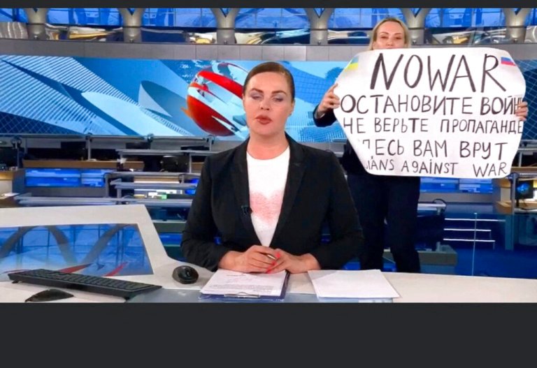 This video grab taken on Tuesday shows Russian Channel One editor Marina Ovsyannikova holding a poster reading, 