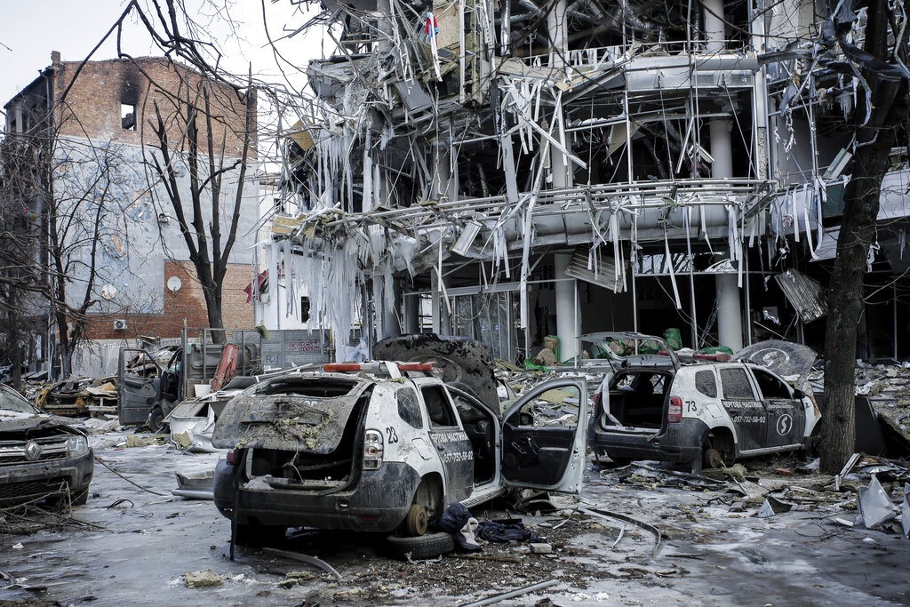 Damaged vehicles sit among the debris in the city center of Kharkiv, Ukraine, on Wednesday.