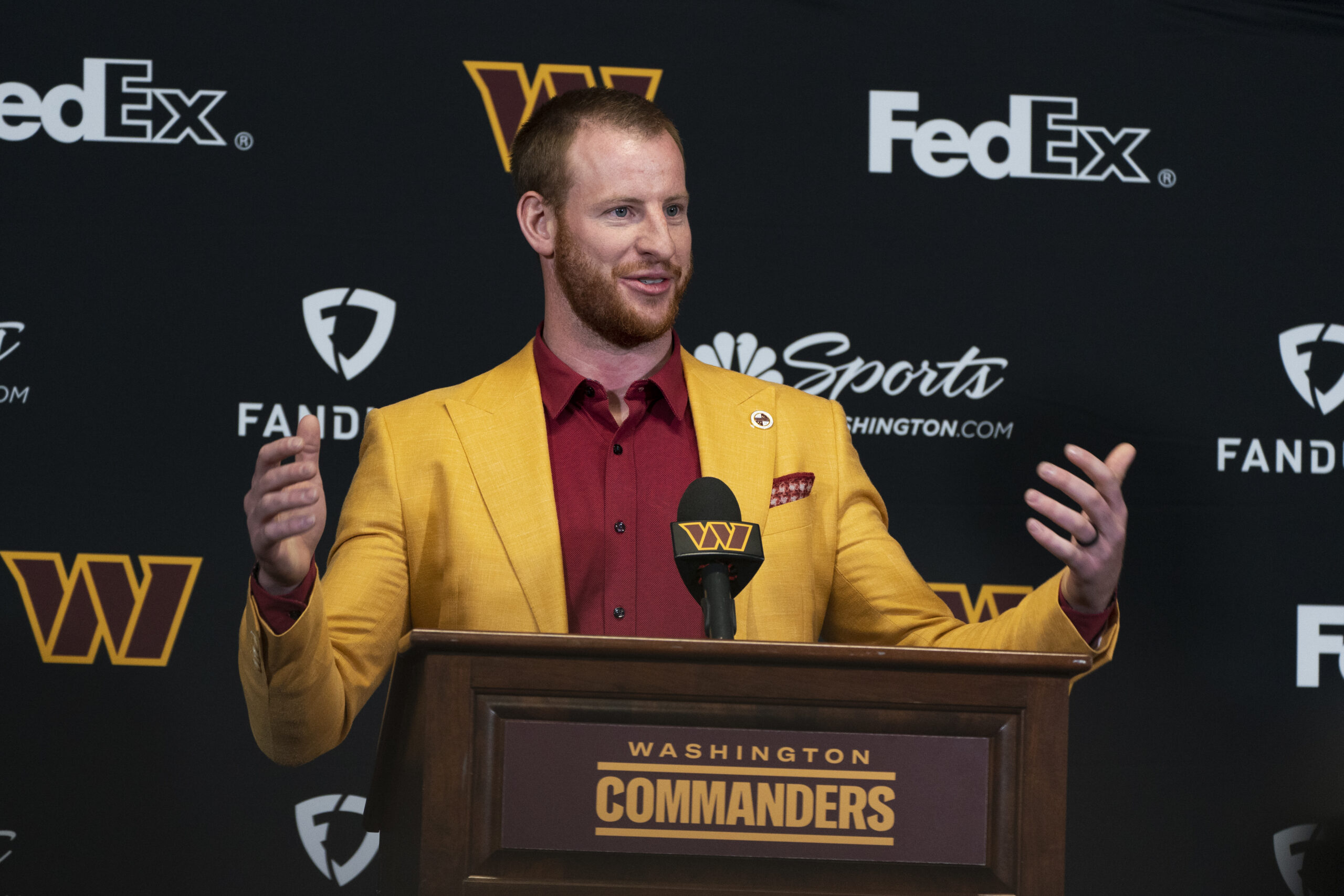 SEE IT: Carson Wentz sacked by criticism of suit at Commanders press conference