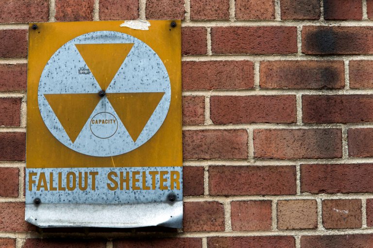 A fallout shelter sign hangs on a building on East 9th Street in New York.