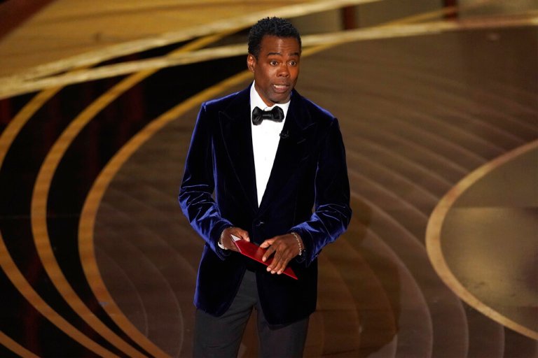 Chris Rock presents an award at the Oscars.