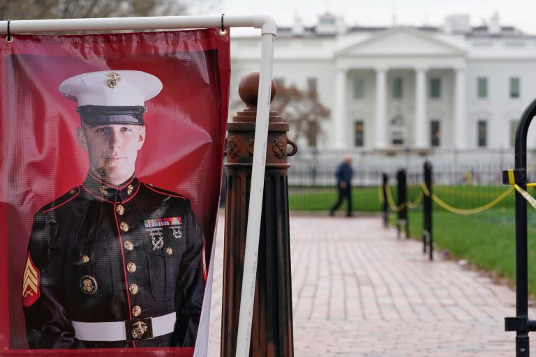 A poster photo of U.S. Marine Corps veteran and Russian prisoner Trevor Reed stands in Lafayette Park near the White House on March 30, 2022, in Washington.