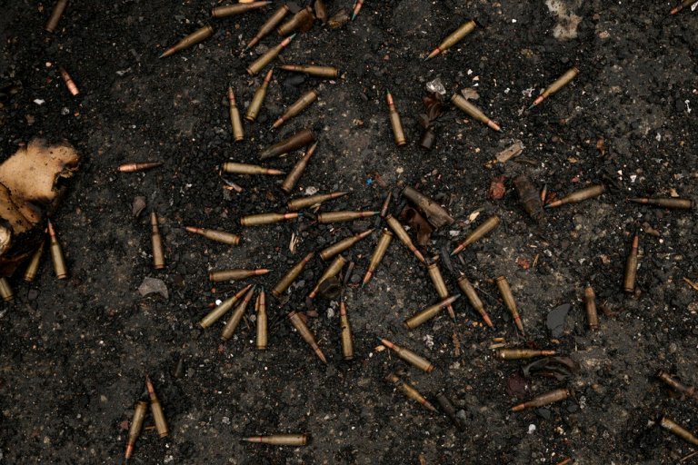 Ammunition is scattered on the ground next to a Ukrainian military armored fighting vehicle destroyed during fighting between Russian and Ukrainian forces in outside Kyiv, Ukraine, Friday, April 1, 2022.