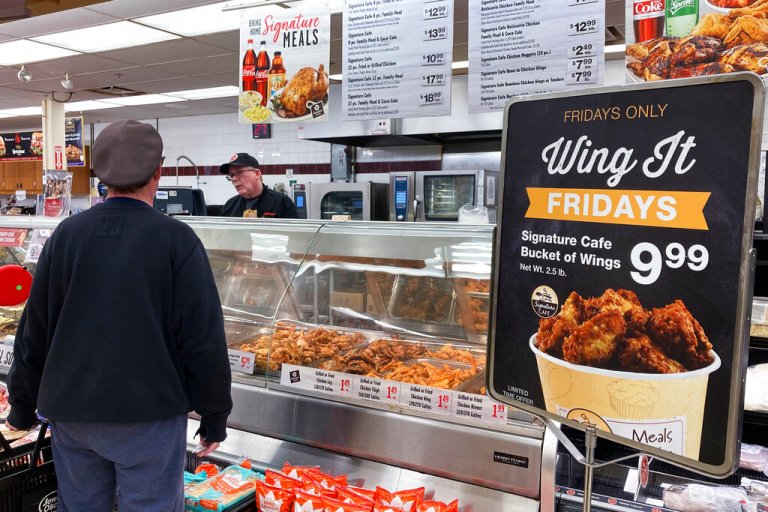 A information sign about limited time offer displayed as a customer shops at a grocery store in Mount Prospect, Ill., Friday, April 1, 2022. USDA says food inflation rate to soar, highest since 2008. 