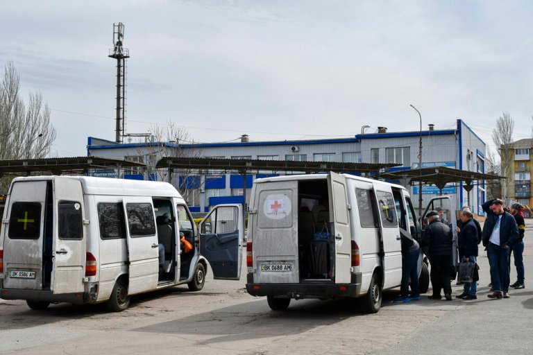 People board buses during the evacuation of civilians in Kramatorsk, Ukraine, Sunday, April 10, 2022. 