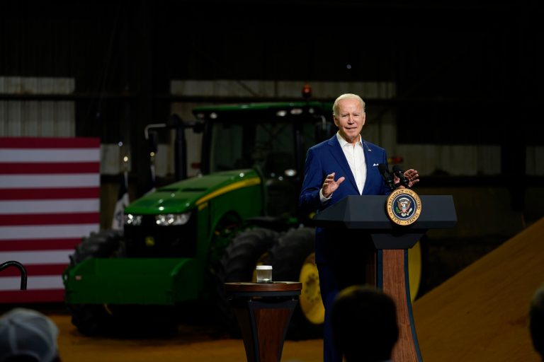 President Joe Biden speaks, with a pile of cornmeal as a backdrop, at POET Bioprocessing in Menlo, Iowa, Tuesday, April 12, 2022. 