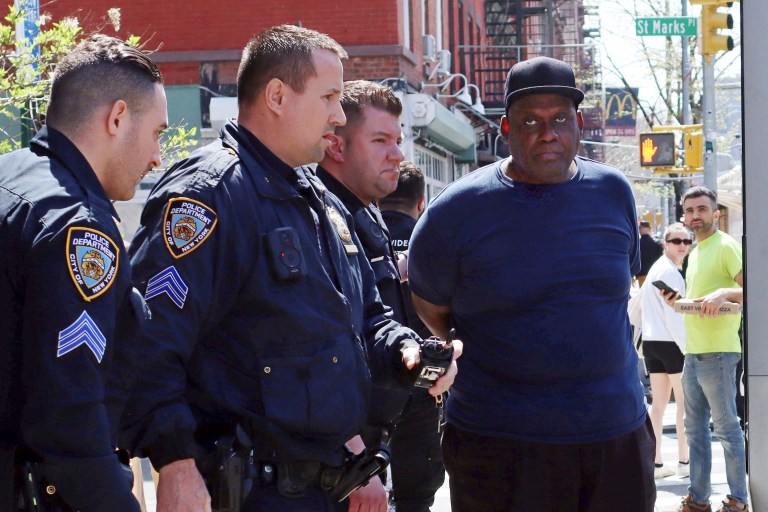 New York City Police Department officers arrest subway shooting suspect Frank R. James, 62, in the Greenwich Village section of New York, Wednesday, April 13, 2022.
