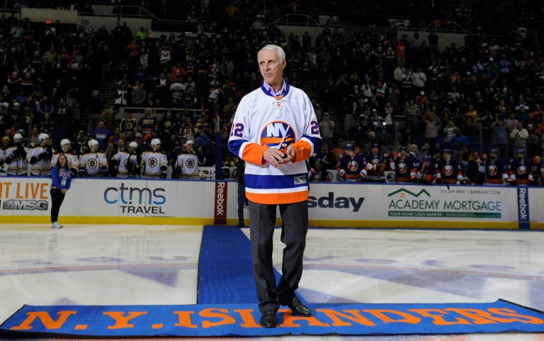 FILE - Hockey Hall of Famer and former New York Islander Mike Bossy is introduced to the fans before he drops a ceremonial first puck.