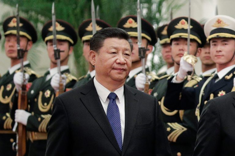 Chinese President Xi Jinping and Finnish President Sauli Niinisto (unseen) review an honor guard at the Great Hall of the People in Beijing, Monday, Jan. 14, 2019. 
