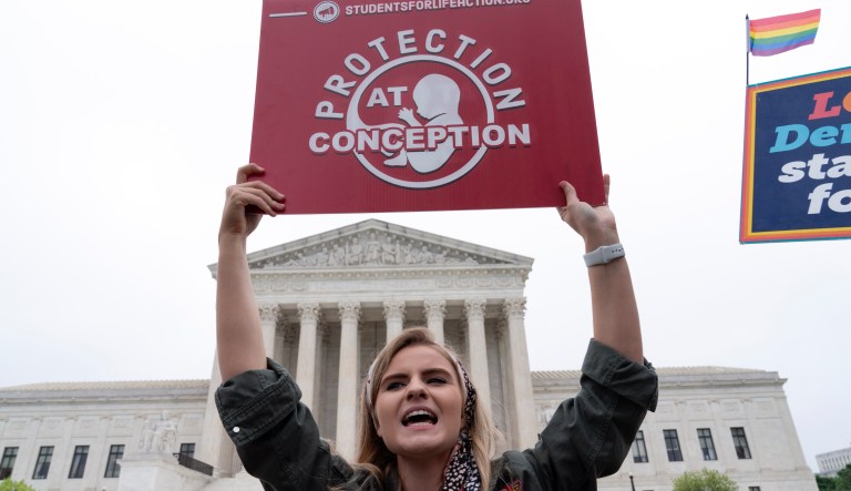 Demonstrators protest outside of the U.S. Supreme Court Tuesday, May 3, 2022 in Washington.