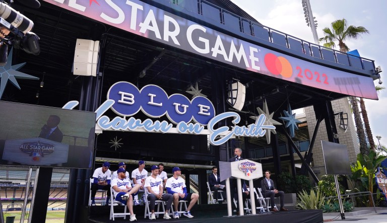 Los Angeles mayor Eric Garcetti, right, speaks as members of the Los Angeles Dodgers look on during an event to officially launch the countdown to MLB All-Star Week Tuesday, May 3, 2022, at Dodger Stadium in Los Angeles. The All-Star Game is scheduled to be played on July 19.