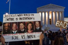 A year after, public opinion steady on overturning Roe