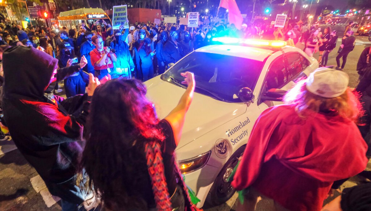 Abortion rights protesters 'throw rocks and bottles' at police in Los Angeles