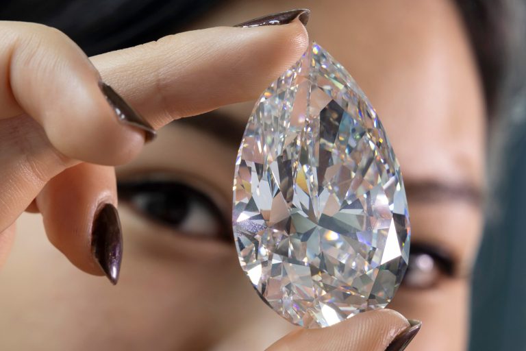 A Christie's employee holds 