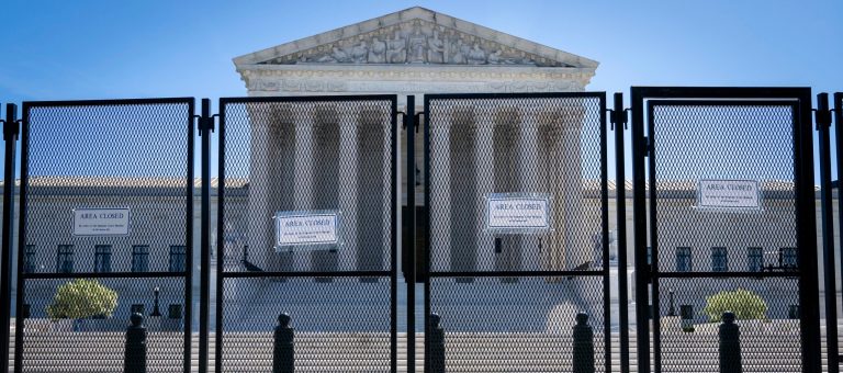 Anti-scaling fencing blocks off the stairs to the Supreme Court.