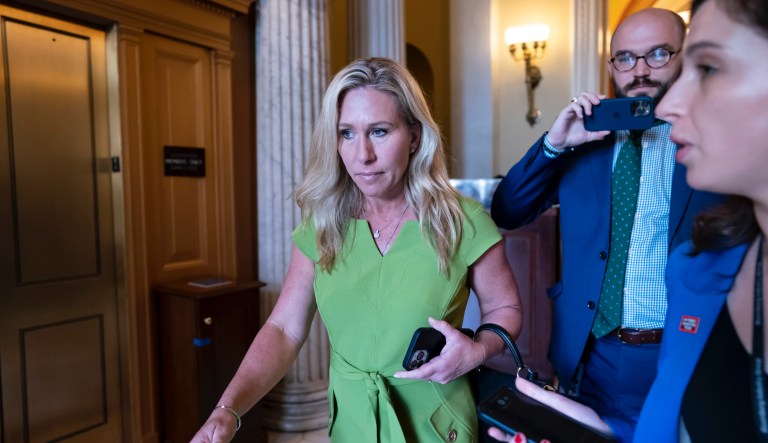 Rep. Marjorie Taylor Greene, R-Ga., departs the House chamber at the end of votes, at the Capitol in Washington, Thursday, May 12, 2022. 