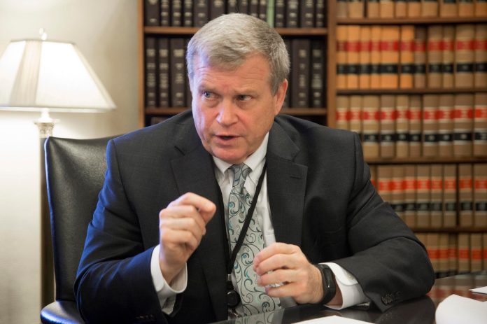 FILE - Idaho Attorney General Lawrence Wasden during an interview in Boise, Idaho, on March 1, 2017. Idaho officials on Friday, May 13, 2022, have announced a $119 million settlement with drugmaker Johnson & Johnson and three major distributors over their role in the opioid addiction crisis. Republican Attorney General Wasden said it's the second-largest consumer settlement in state history, trailing only the 1998 national tobacco settlement of $712 million. 