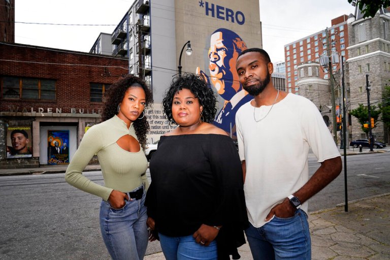 D'Zhane Parker, left, Cicley Gay, center, and Shalomyah Bowers pose for a portrait on Friday, May 13, 2022, in Atlanta.