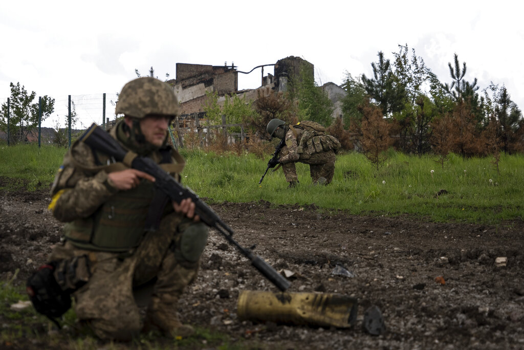 Ukraine drives Russians out of Kharkiv, plants flag on border with Russia, officials say