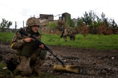 Ukraine drives Russians out of Kharkiv, plants flag on border with Russia, officials say