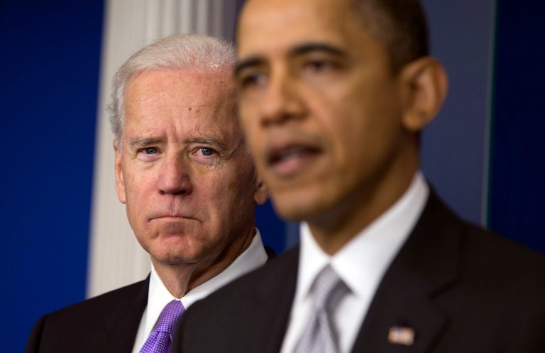 Vice President Joe Biden, left, listens as President Barack Obama speaks.