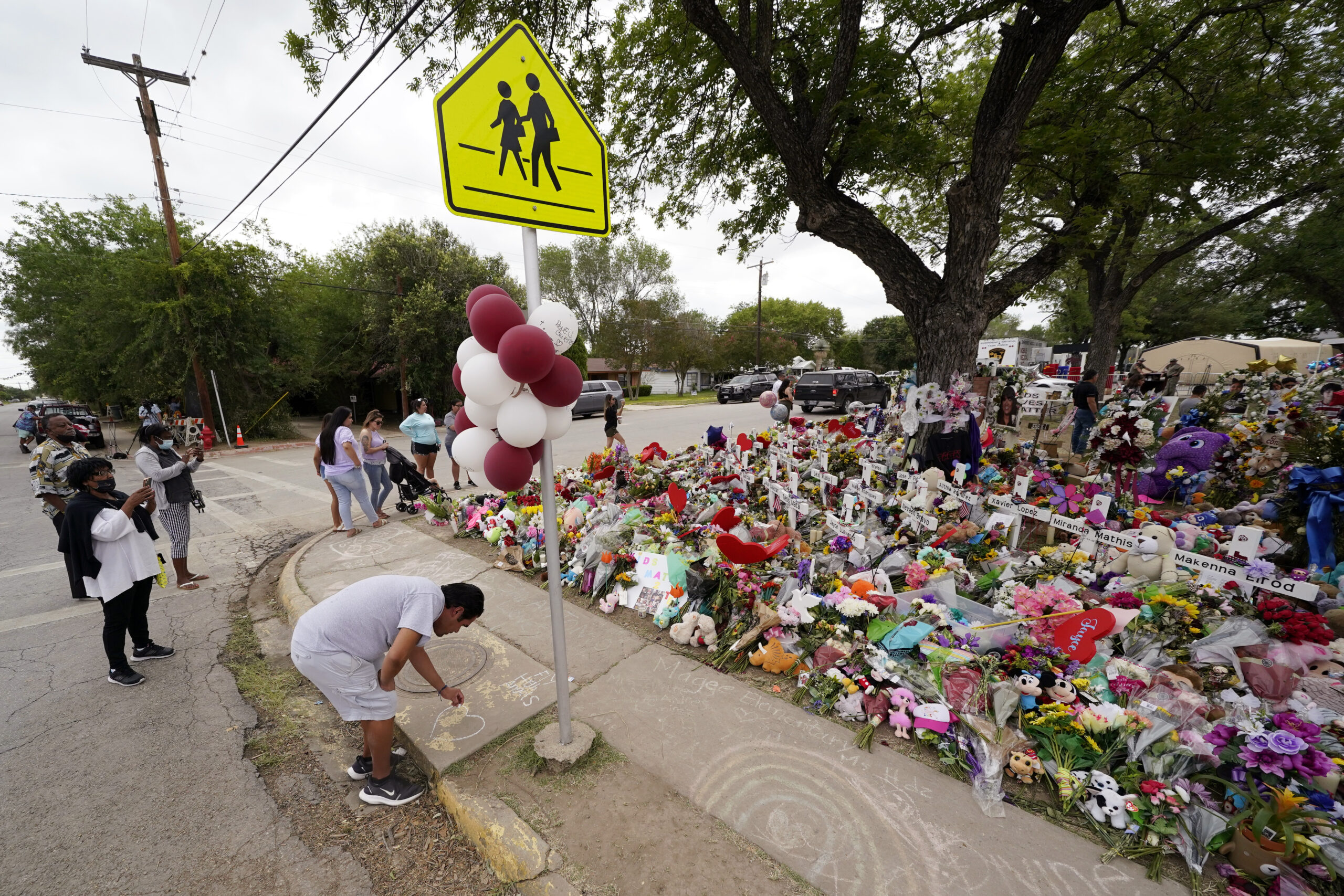 Uvalde teacher remembers shutting propped-open door during shooting, lawyer says