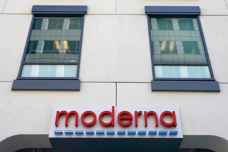 In this Dec. 15, 2020, file photo, a sign for Moderna, Inc. hangs on its headquarters in Cambridge, Mass. Moderna's experimental COVID-19 vaccine that combines its original shot with protection against the omicron variant appears to work, the company announced Wednesday, June 8, 2022. (AP Photo/Elise Amendola, File)